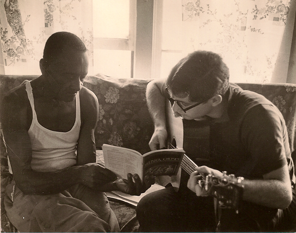 Mance Lipscomb and Michael Birnbaum look at music in Mance's living room